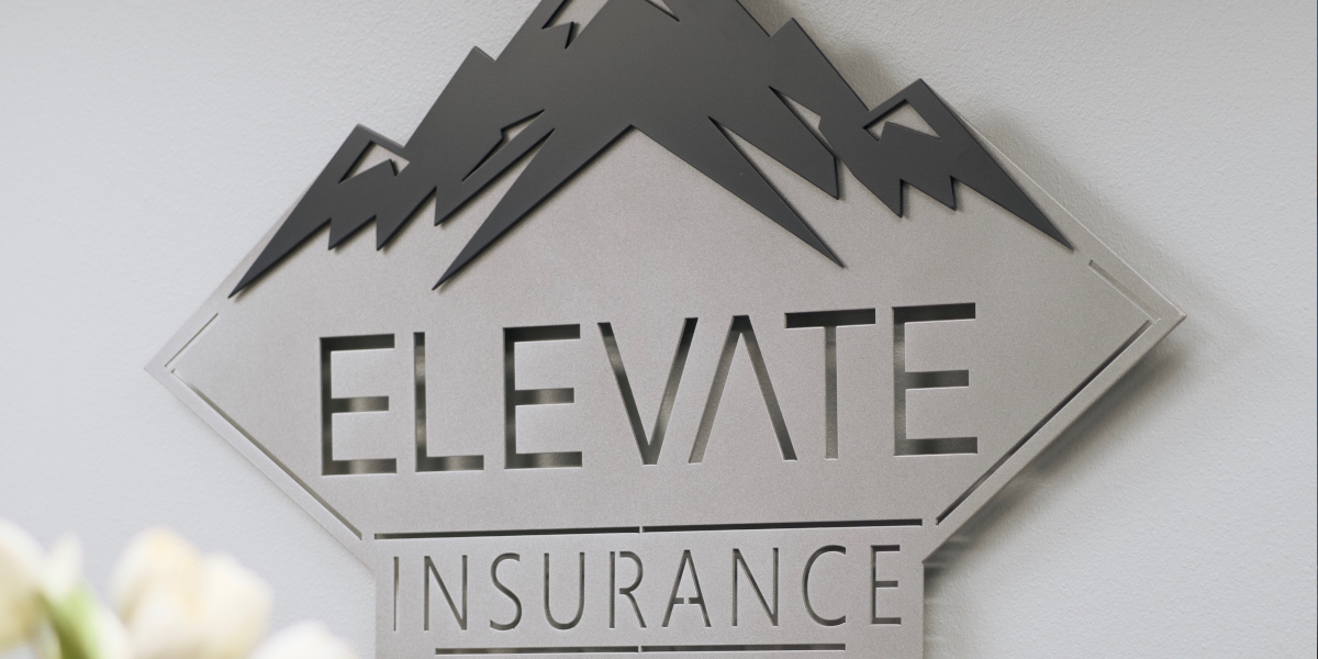 Two employees standing in front of their coffee shop